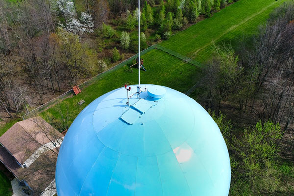 Inspect the top of water towers with drones